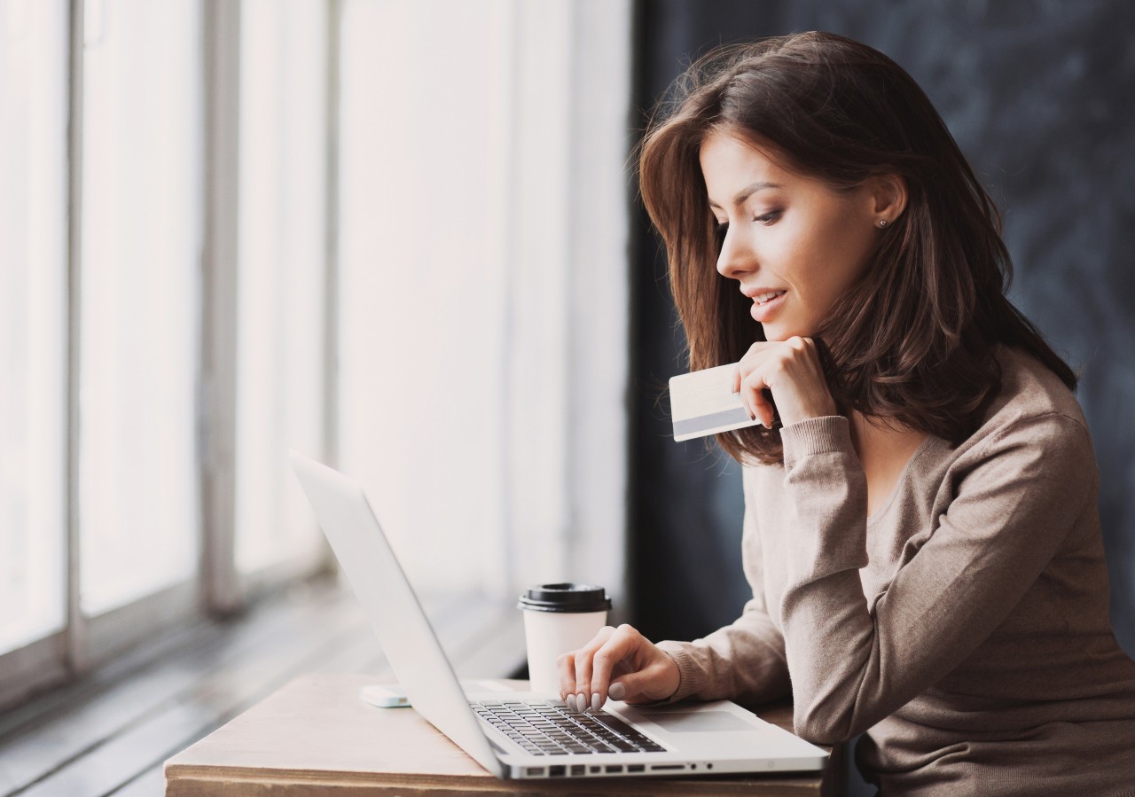 A Girl Reading About Credit Cards